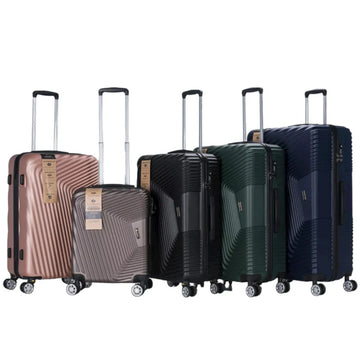 Set of five suitcases in different colors on a white background