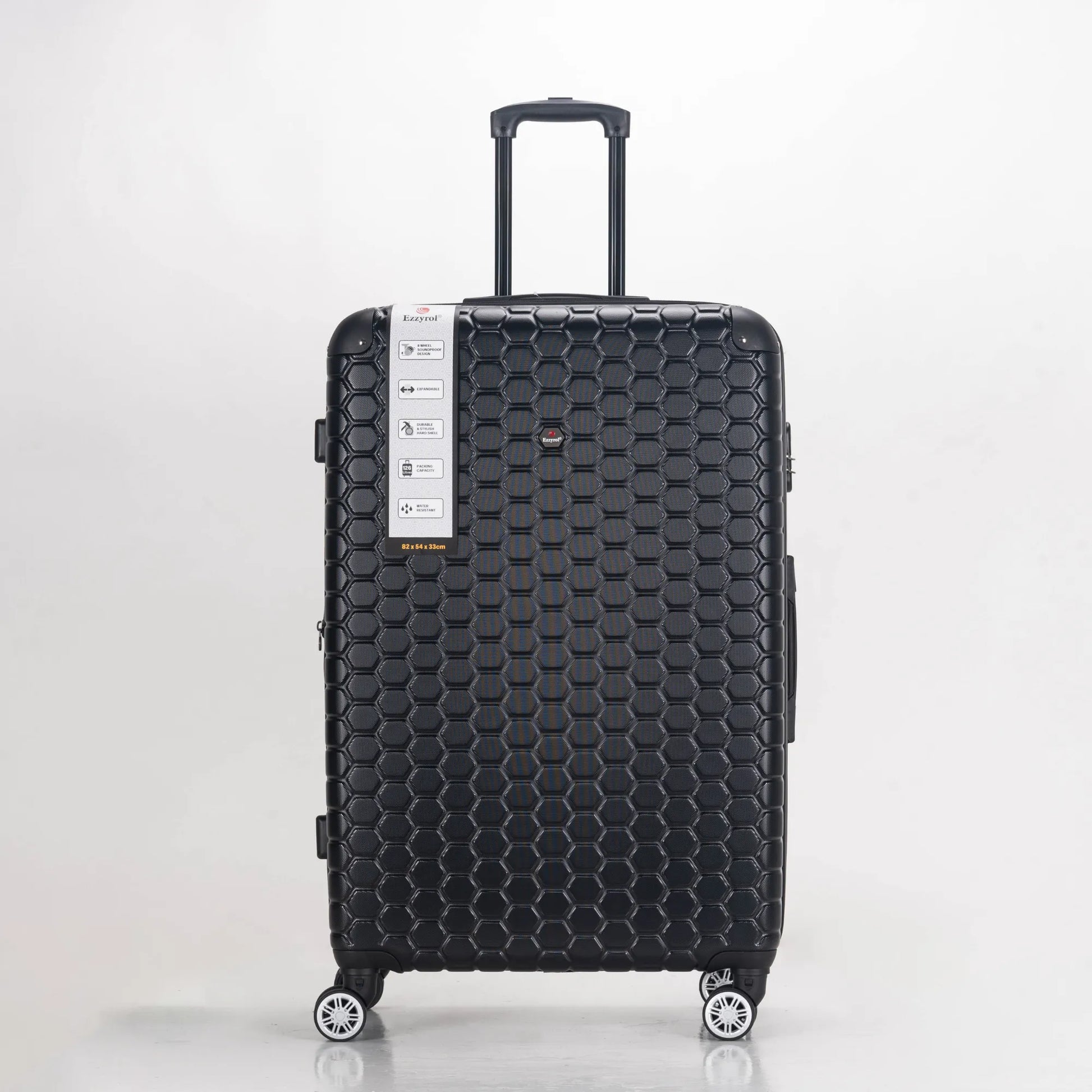 Black honeycomb-patterned suitcase on a white background