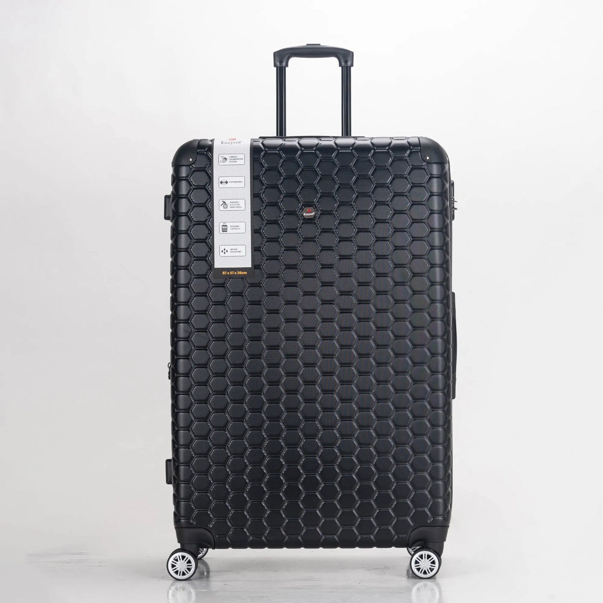 Black honeycomb-patterned suitcase on a white background