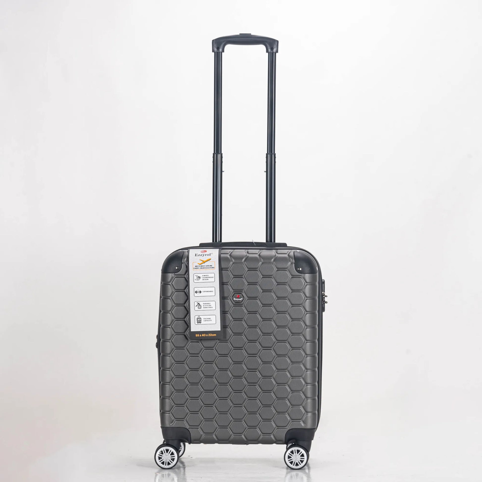 Gray suitcase with a honeycomb pattern on a light gray background