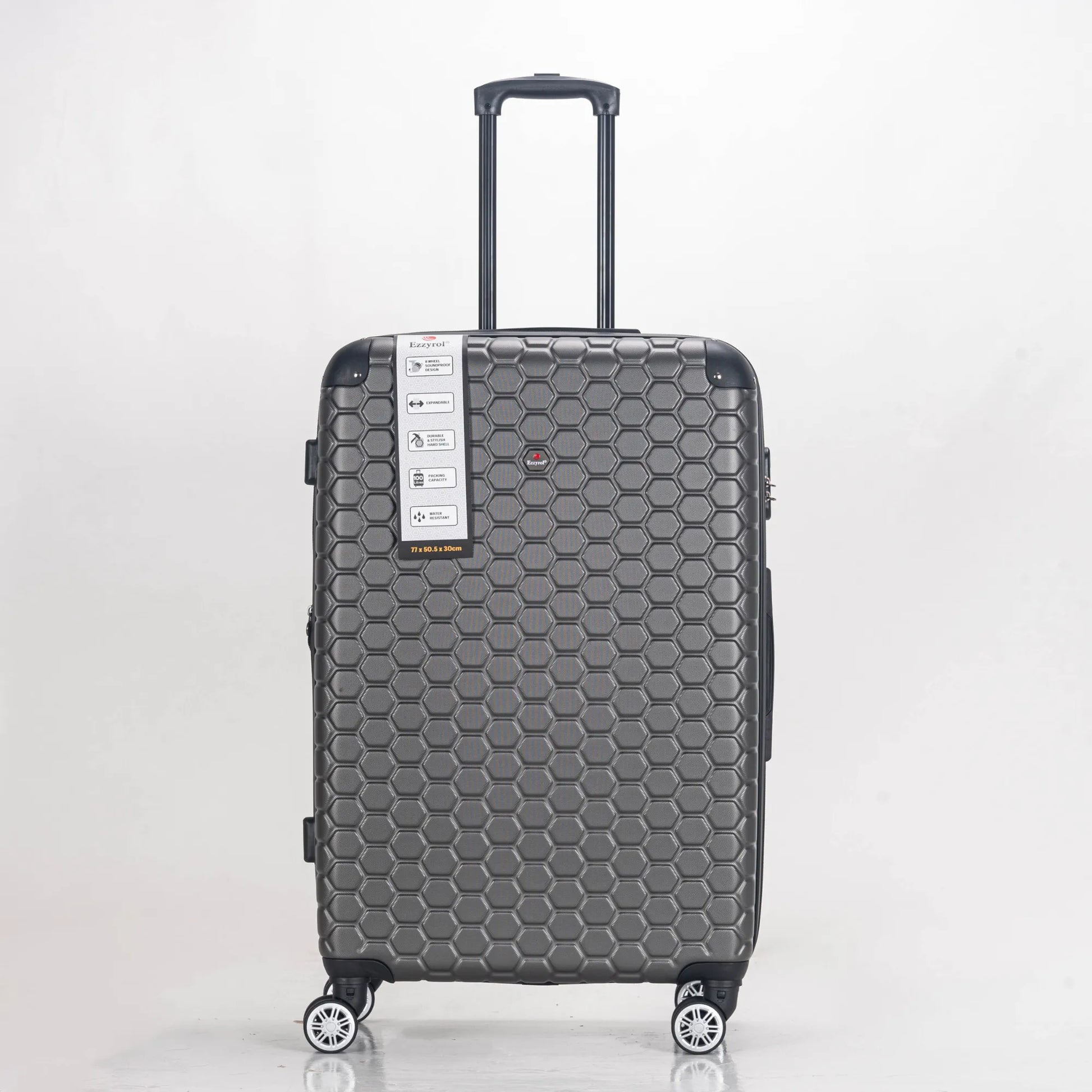 Gray suitcase with honeycomb pattern on a white background