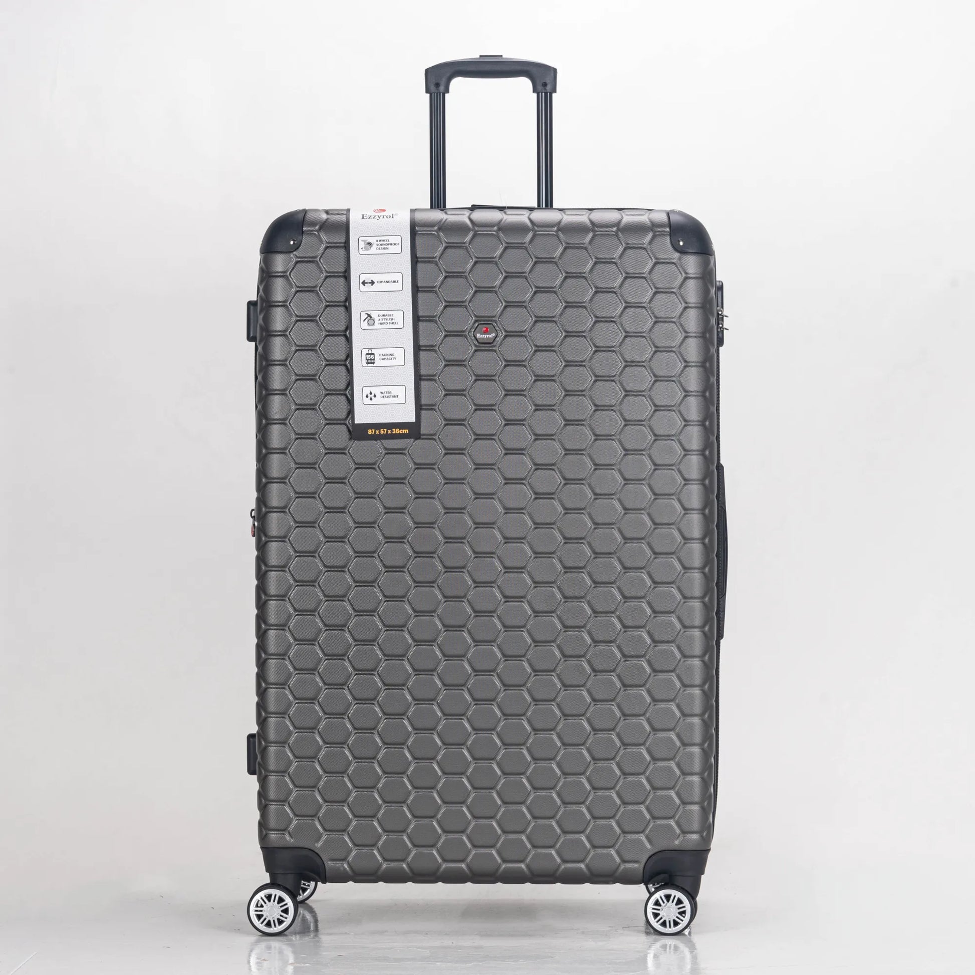 Gray suitcase with honeycomb pattern on a white background