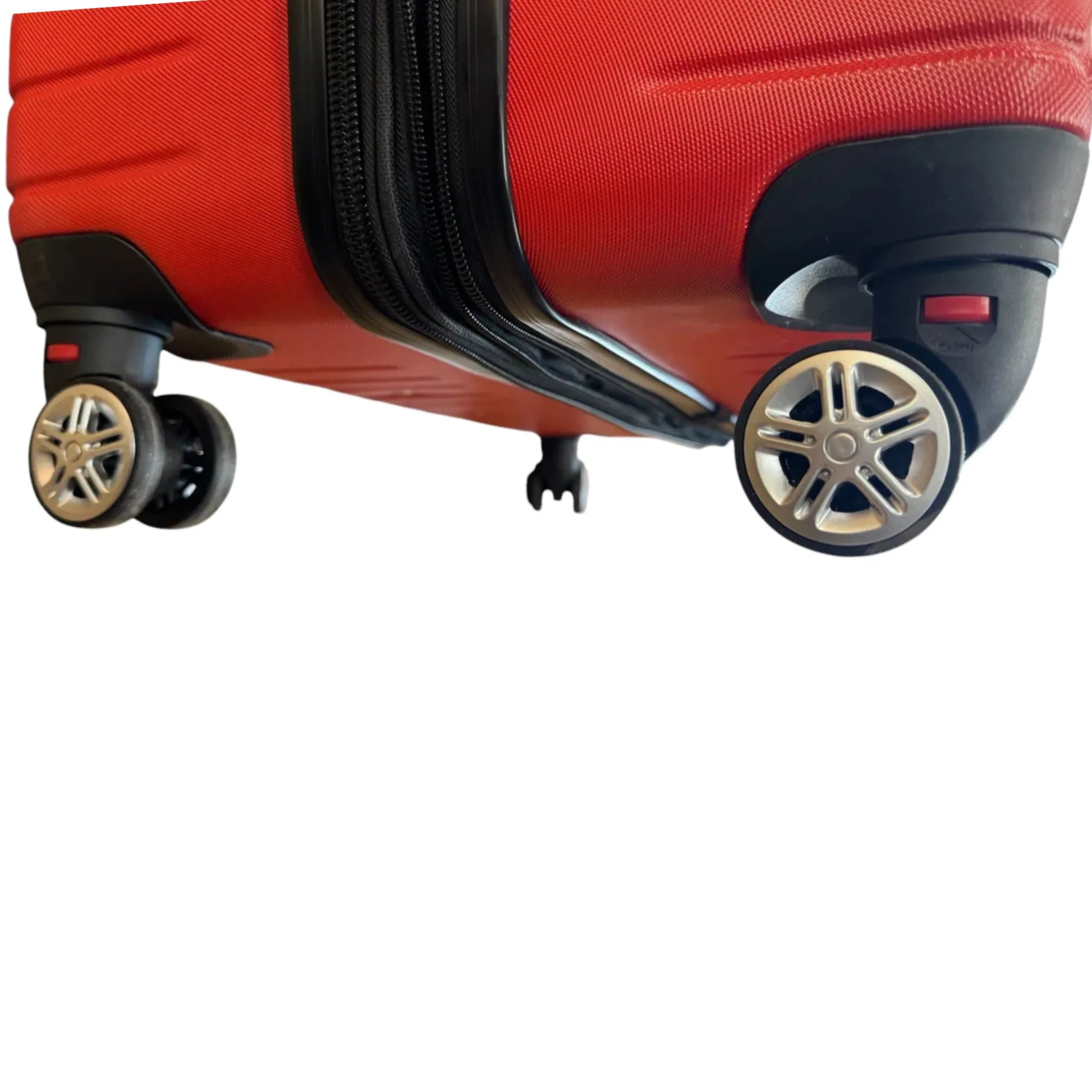 Close-up of a red suitcase with wheels on a white background