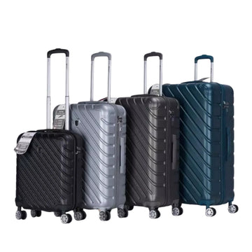 Set of four suitcases in black, gray, and blue on a white background