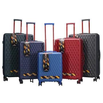 Set of colorful suitcases with diamond pattern on a white background