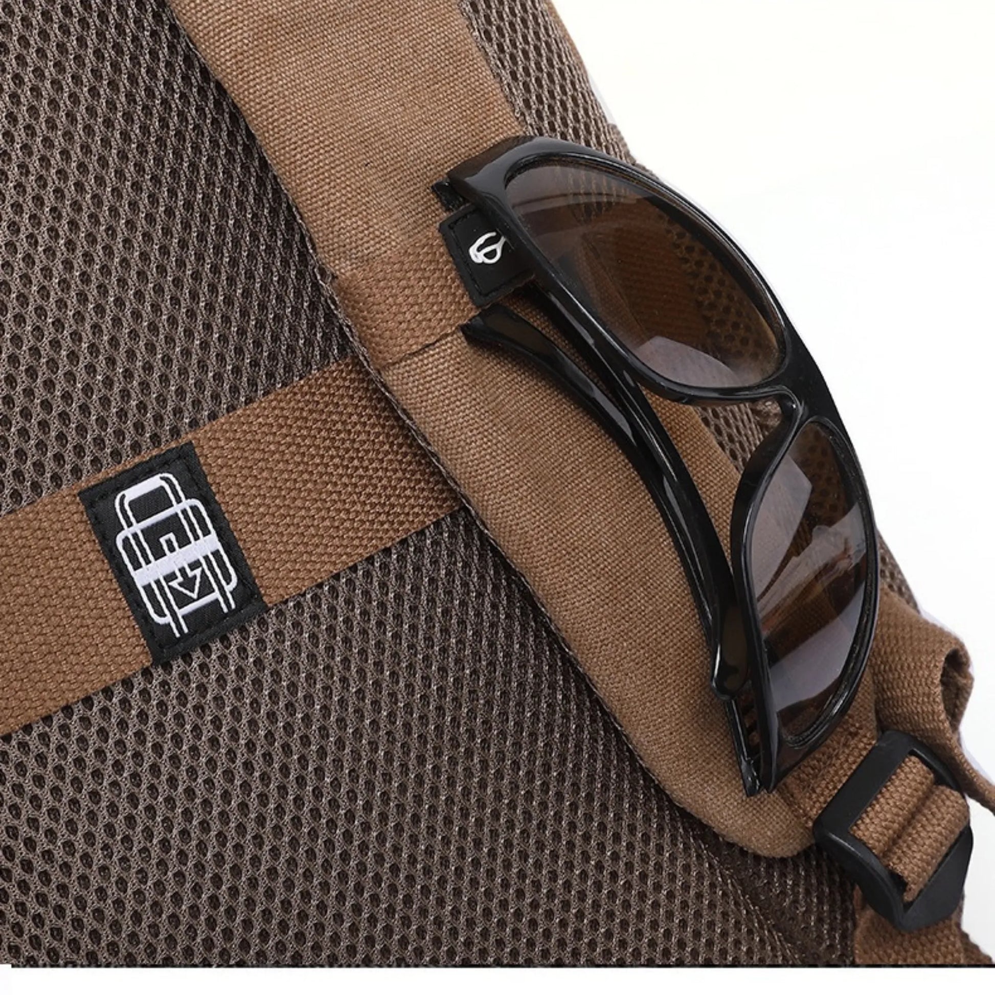 Brown backpack with sunglasses on a white background