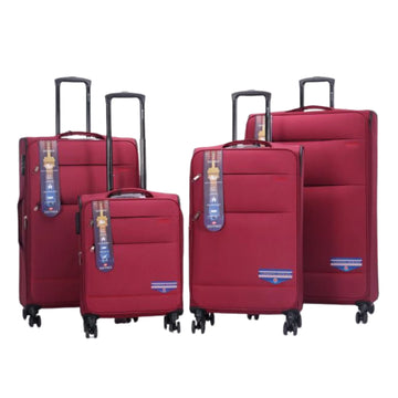 Set of red suitcases with tags on a white background