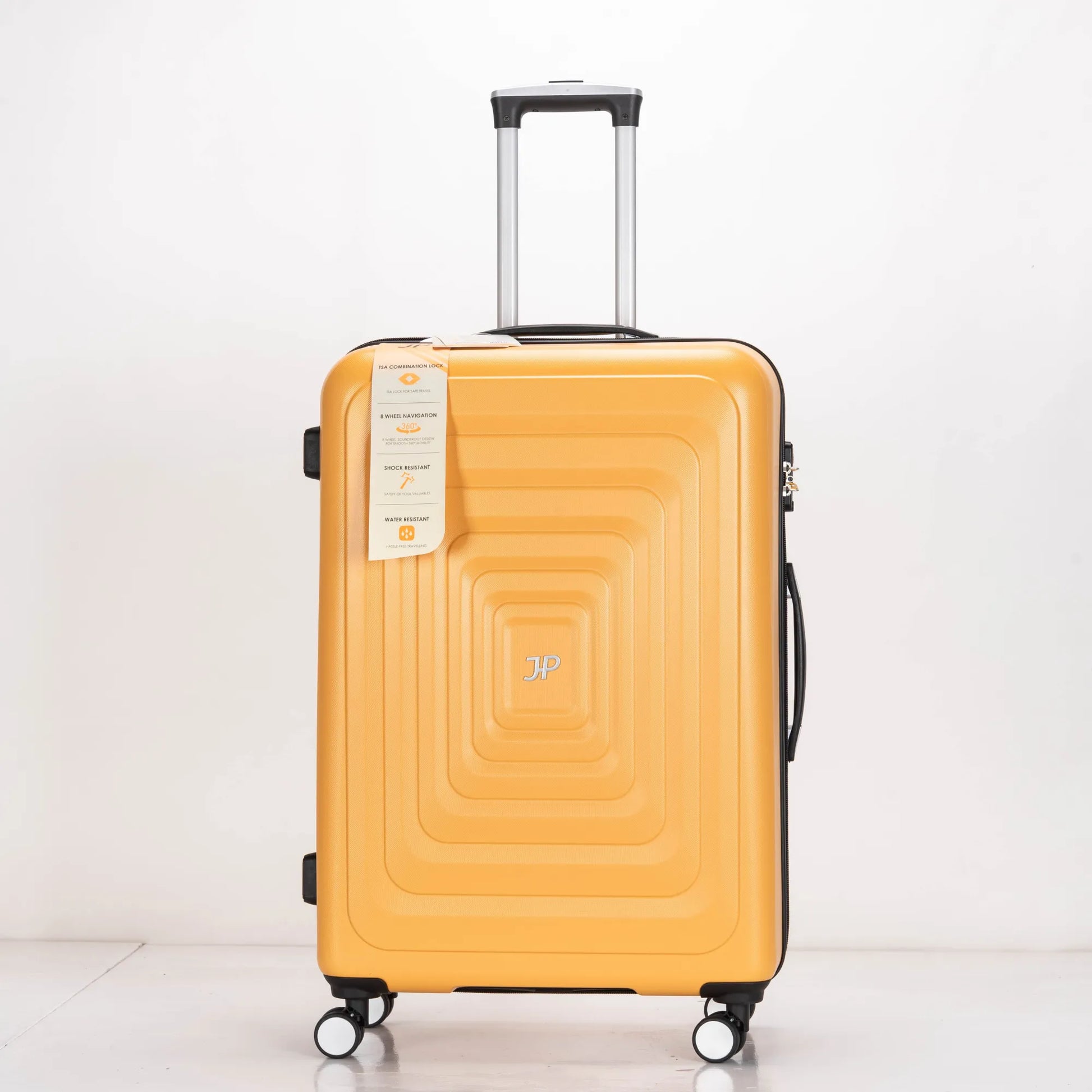 Yellow suitcase with a brand tag on a white background