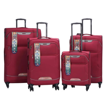 Set of red suitcases with tags on a white background
