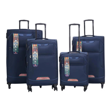 Set of four navy blue suitcases with colorful tags on a white background
