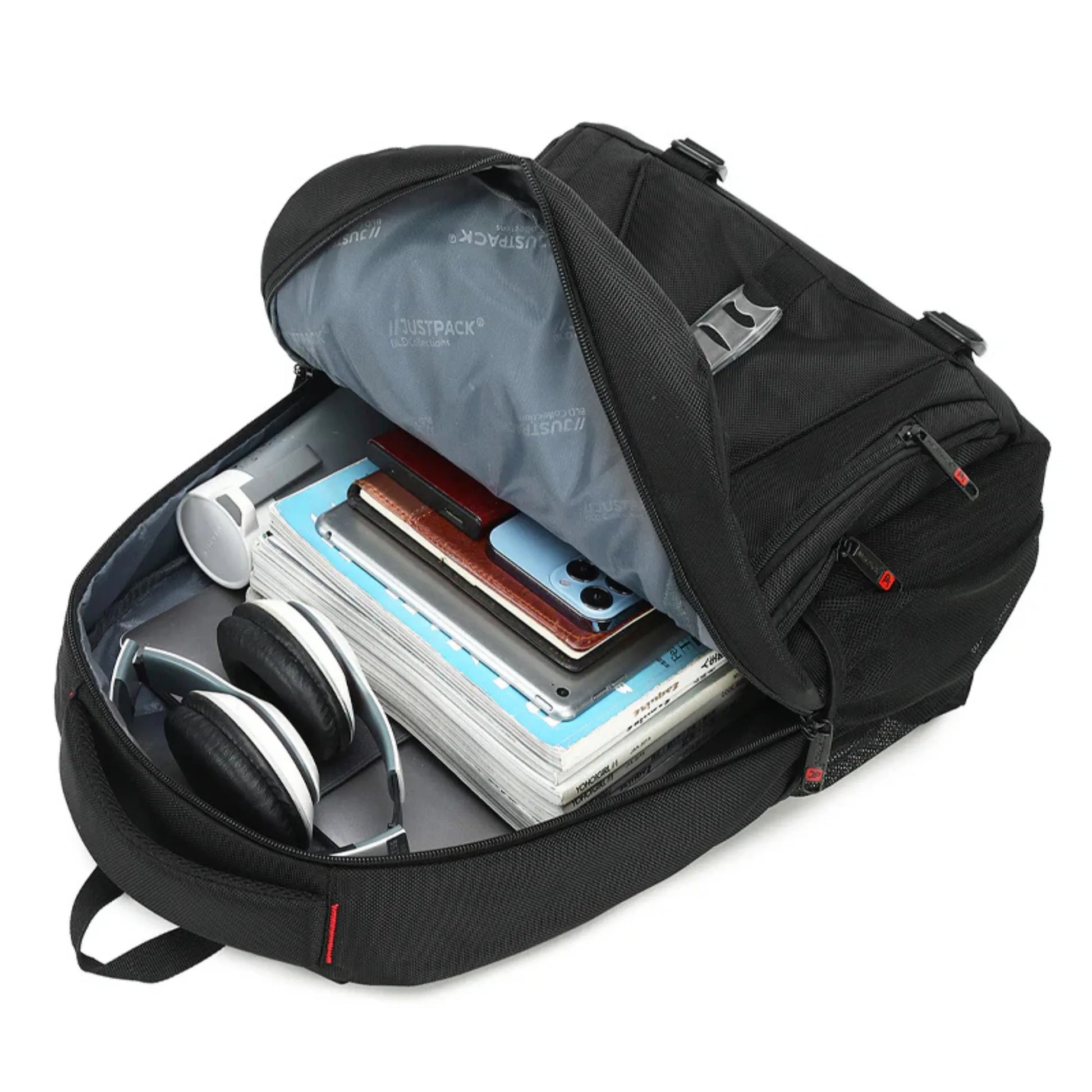 Black backpack with compartments containing electronic devices and office supplies on a white background