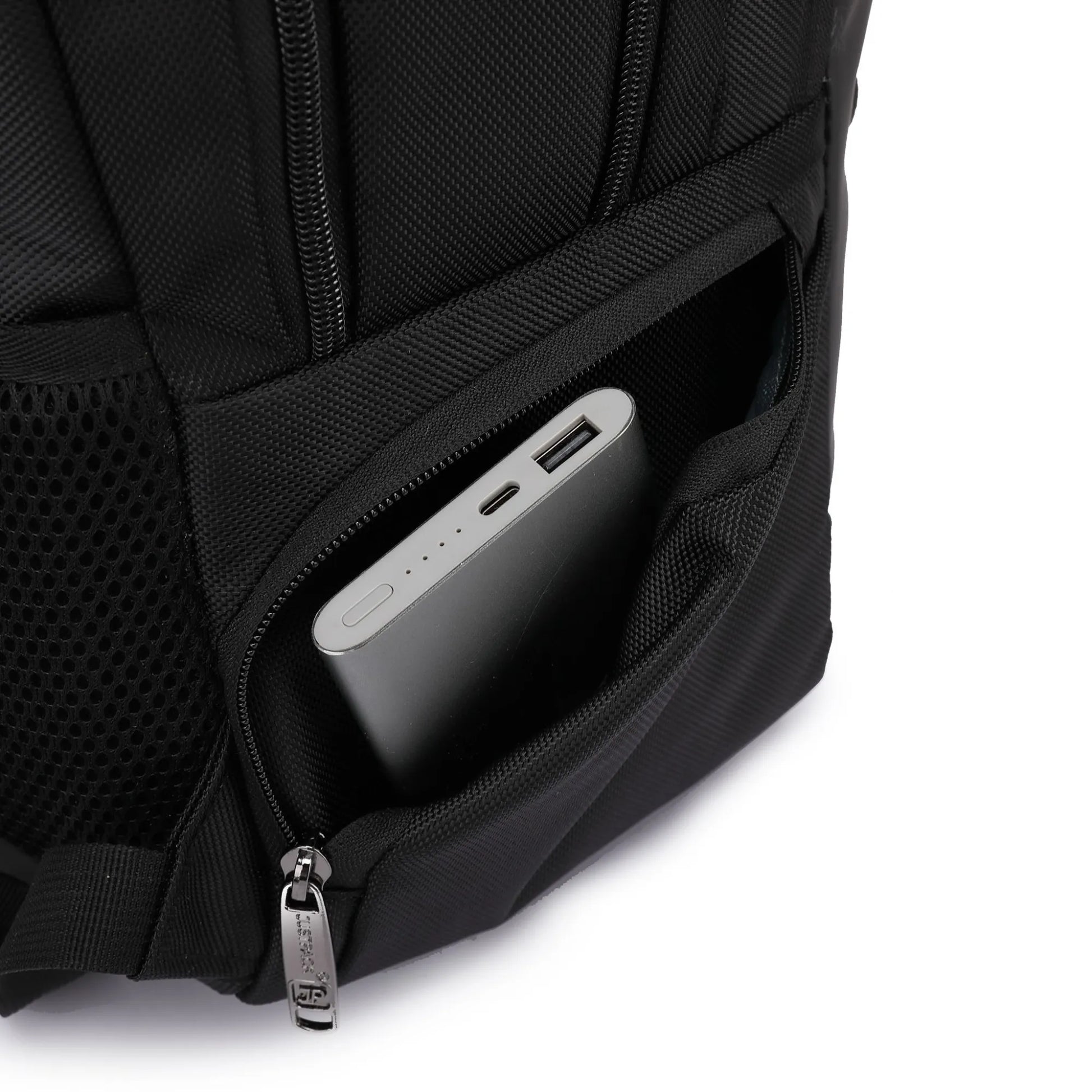 Black backpack with a power bank in an open compartment on a white background